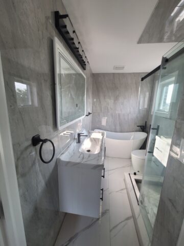inished small bathroom renovation in Toronto with modern vanity and shower